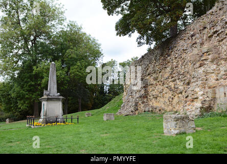 Norman stone wall remains and Boer War memorial outside Tonbridge Castle in Kent, England Stock Photo