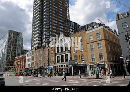 Street view of Norton Folgate and high rise modern Principal Tower in the City of London near Spitalfields East London England  UK  KATHY DEWITT Stock Photo