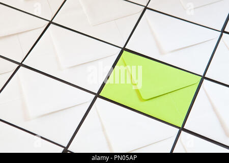 Composition with white and green envelopes on the table. Different colored envelopes on the table. Stock Photo