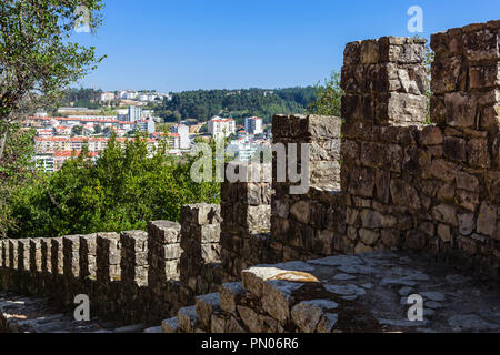 Leiria, Portugal. Close-up on a castle defensive wall with the battlements, merlons, crenels or crenellation of the wall and wallwalk in Leiria Castle Stock Photo