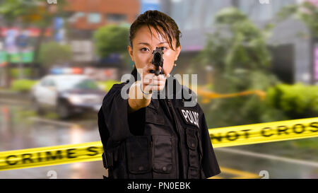 Chinese female police officer with pistol Stock Photo - Alamy