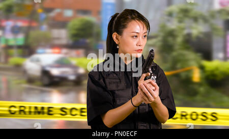 Chinese female police officer with pistol Stock Photo - Alamy