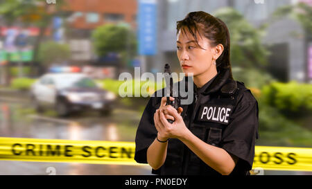 Chinese female police officer with pistol Stock Photo - Alamy
