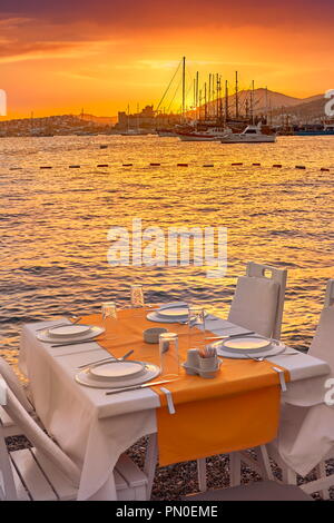Beach outdoor restaurant at sunset, Bodrum, Turkey Stock Photo