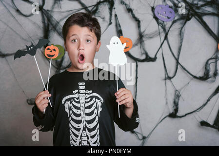 boy in skeleton costume at halloween party Stock Photo