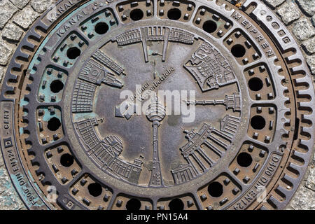 Berlin, Germany, July 28, 2018: Close-Up of Carvings on Metallic Manhole Lid Stock Photo