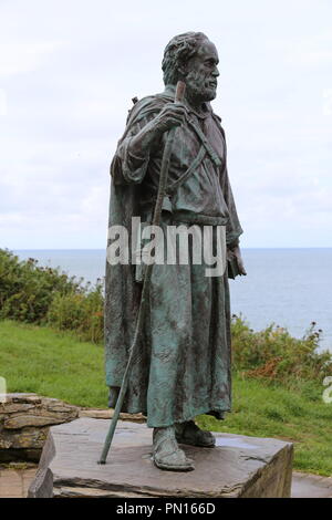 Statue of St Carannog looks down over village he founded. Llangrannog, Cardigan Bay, Ceredigion, Wales, Great Britain, United Kingdom, UK, Europe Stock Photo