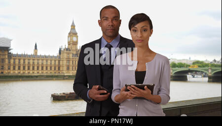 Confident Black male and female professionals posing together in London Stock Photo
