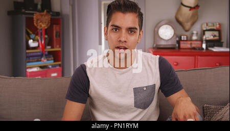 Young millennial Hispanic man talking to camera Stock Photo