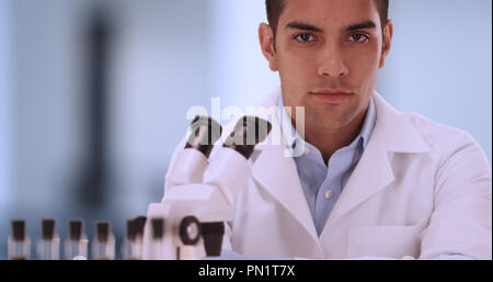 Portrait of handsome millennial male scientist inside laboratory Stock Photo