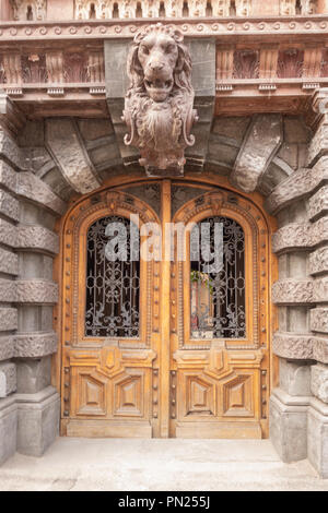 Fragment of an old oak arched double-leafed door. Stock Photo