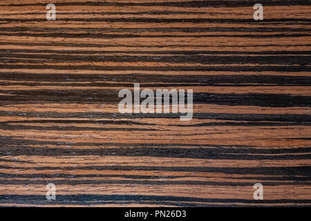 Dark ebony veneer, natural wooden background on macro. Extremely high resolution photo Stock Photo