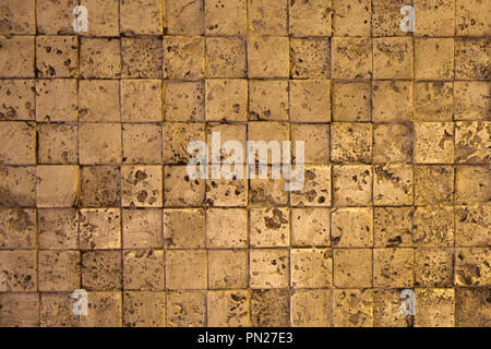 Wall made of cut stone and cement Stock Photo