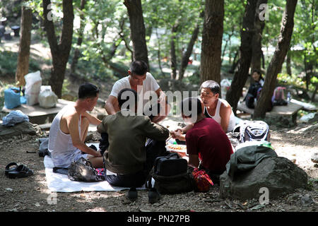 North Koreans enjoying a picnic in the park in Pyongyang Stock Photo