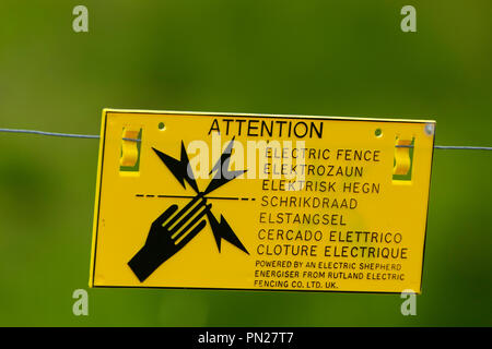 Warning sign on electric fence. Stock Photo