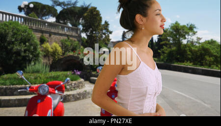 Attractive Latina tourist in sundress on street in Florence Italy Stock Photo