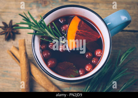 Christmas drink (winter hot drink). Mulled wine punch and spices for glintwine on vintage wooden table background top view. Copy space Stock Photo