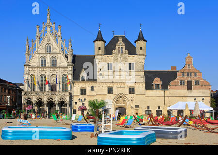 The medieval town hall with belfry at the market square during summertime in Mechelen, Belgium Stock Photo