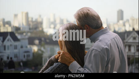 Rear view of mature couple looking at Golden Gate bridge San Francisco Stock Photo