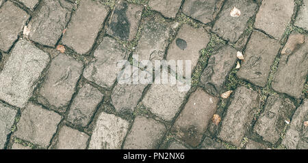 The old road of broken paving stones. It can be used for backgrounds, textures Stock Photo