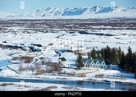 View from above of snow-covered, famous tourist sight Thingvellir National Park - Pingvellir - church and summer residence of Prime Minister of Icelan Stock Photo