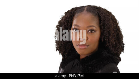 Close up of black woman with soft pretty eyes looking at camera in studio Stock Photo