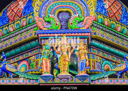 Colorful night view of indian gods sculpture at Sri Maha Mariamman Temple, also known as Maha Uma Devi temple, the public hindu temple in Silom, Bangk Stock Photo