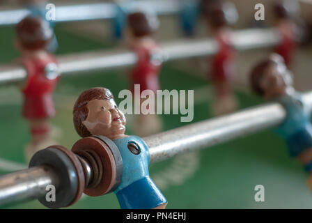 Blue model player on a foosball game Stock Photo