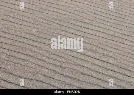 Natural wind-blown wave pattern in grainy sand at Great Sand Dunes National Park, Colorado Stock Photo