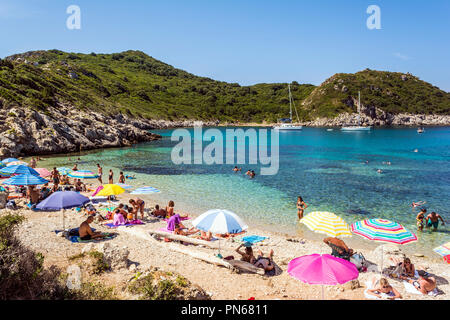 Corfu, Greece - August 23, 2018: Tourists visit hidden Porto Timoni double beach in Corfu Island, Greece. Stock Photo