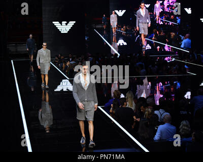 Milan, Italy. 20th Sep, 2018. Models walk the runway at the Emporio Armani fashion show during Milan Fashion Week Spring/Summer 2019 in Milan, Italy, on Sept. 20, 2018. Credit: Alberto Lingria/Xinhua/Alamy Live News Stock Photo
