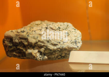 Granite stone specimen from mining and quarrying industries. Granite is a common type of felsic intrusive igneous rock that is granular and phaneritic Stock Photo