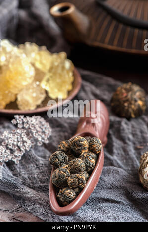 rolled tea leaves into a large pearl. Chinese tea from Yunnan province. Biluochun. Tea ceremony. Stock Photo