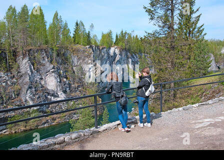 RUSKEALA, KARELIA, RUSSIA - MAY 14, 2016: People take pictures in The Mountain Park. Marble quarry. It is National heritage culture  object Stock Photo