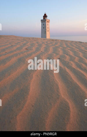 Rubjerg Knude Lighthouse - an abandoned lighthouse slowly being reclaimed by the shifting sands on the North Sea coast near Lokken, Hjorring, Denmark. Stock Photo