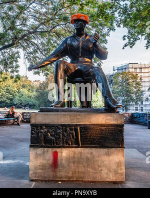 Berlin Mitte. Public art -  sculpture of Poet, Heinrich Heine monument - by sculptor, Waldemar Grzimek.  statue with a hat and bicycle chain necklace Stock Photo