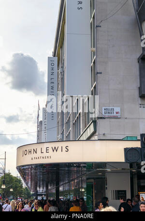 Entrance sign and canopy outside the flagship John Lewis & Partners department store in Oxford Street in the West End shopping area of central London Stock Photo