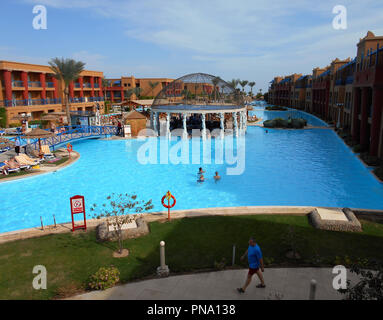 One of the huge swimming pool facilities at an hotel on the Red Sea holiday resort of Hurghada in Egypt. Stock Photo