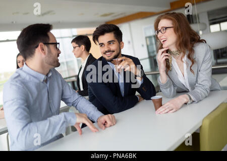 Business colleagues having conversation during coffee break Stock Photo