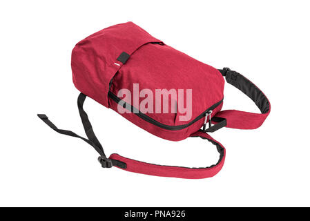 Red backpack lies, isolation on a white background. Stock Photo