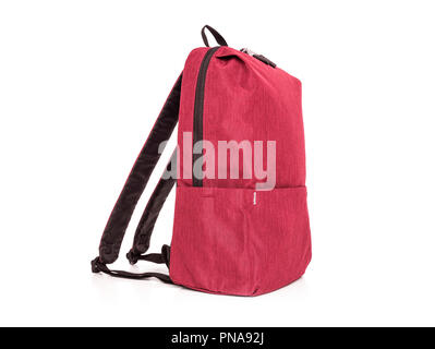 Red sporty backpack on a white background. Stock Photo