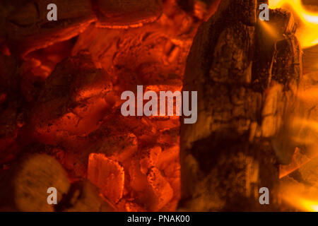 Glowing coal close-up pieces background Stock Photo