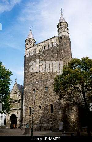 Netherlands. Maastricht. Basilica of Our Lady (Basiliek van Onze-Lieve-Vrouw). Romanesque style church. View of Entrace Merode Chapel and westwork. A 13th-century Gothic portal, rebuilt in the 15th century, provides access to the church as well as to the so-called Mérode chapel (or Star of the Sea chapel). The westwork, built of carbonic sandstone, dates from the early 11th century and is flanked by two narrow towers with marlstone turrets. Stock Photo