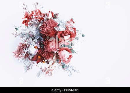 Bouquet of autumn flowers in red, burgundy and shades of Red Pear. Fashionable colors autumn winter 2018. Ingredients: roses, berries, chrysanthemum, asters, kosmeja, hydrangea, wormwood. Flower composition on a white background Stock Photo