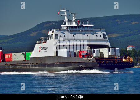 A front view of a large ferry boat loaded with tractor trailers full of freight traveling out of the harbour at the city of Nanaimo on vancouver Islan Stock Photo