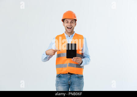 Engineer holding tablet mobile phone with blank black screen with copy space on white background Stock Photo