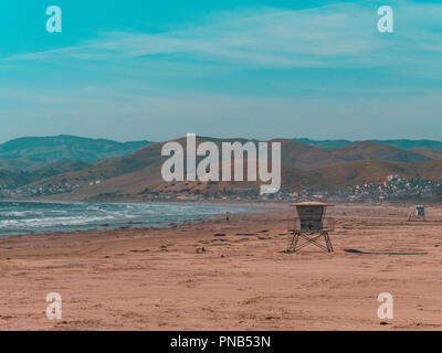 Lone lifeguard cabin standing on the beach on a windy summers day Stock Photo