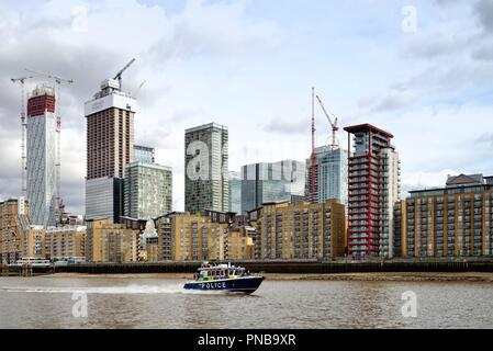 New building developments at Canary Wharf viewed from the River Thames east London England UK Stock Photo