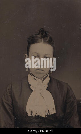 * Vintage 1860's - 1870's Tintype Photograph of an Unhappy Young Lady Wearing a Neck Scarf Stock Photo