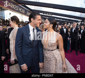 Gina Rodriguez and guest arrives on the red carpet of The 90th Oscars® at the Dolby® Theatre in Hollywood, CA on Sunday, March 4, 2018.  File Reference # 33546 118PLX  For Editorial Use Only -  All Rights Reserved Stock Photo